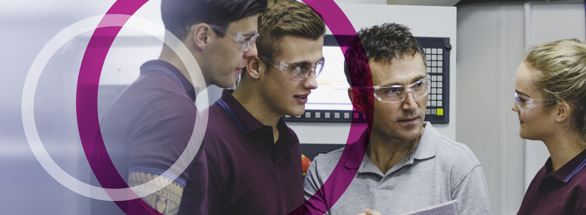 People gathered around a machine having a discussion